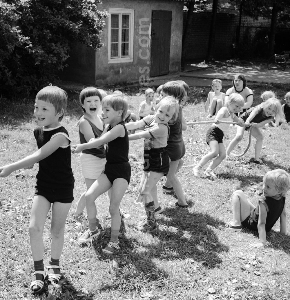Berlin: Children celebrate the International Children's Day at a preschool in Berlin, the former capital of the GDR, German Democratic Republic. On this day there was always a festive program which consisted of sport and play. Here the tug