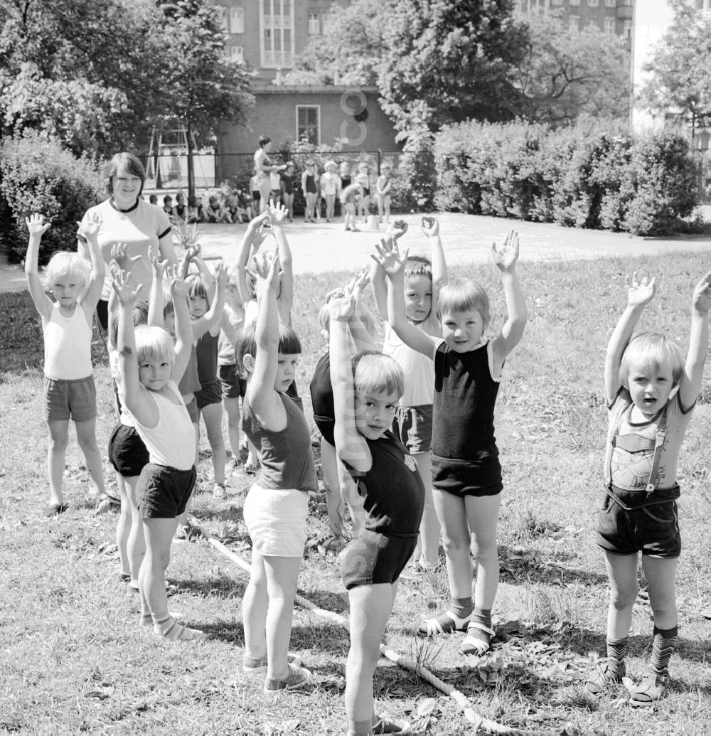 GDR image archive: Berlin - Children celebrate the International Children's Day at a preschool in Berlin, the former capital of the GDR, German Democratic Republic. On this day there was always a festive program which consisted of sport and play. Here the tug