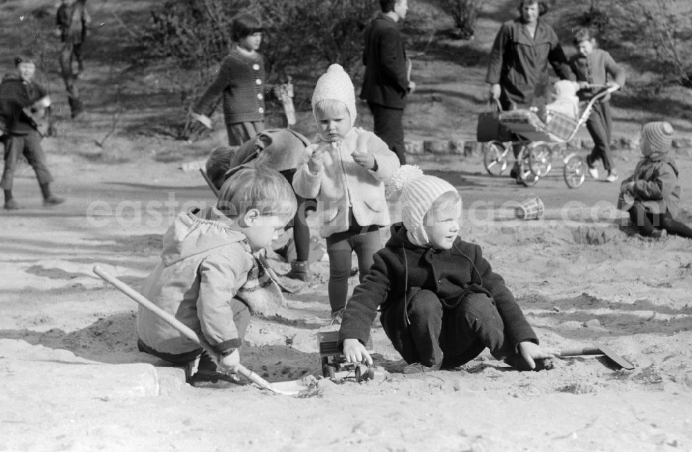 Berlin: Children playing in the sandpit in Berlin, the former capital of the GDR, German Democratic Republic