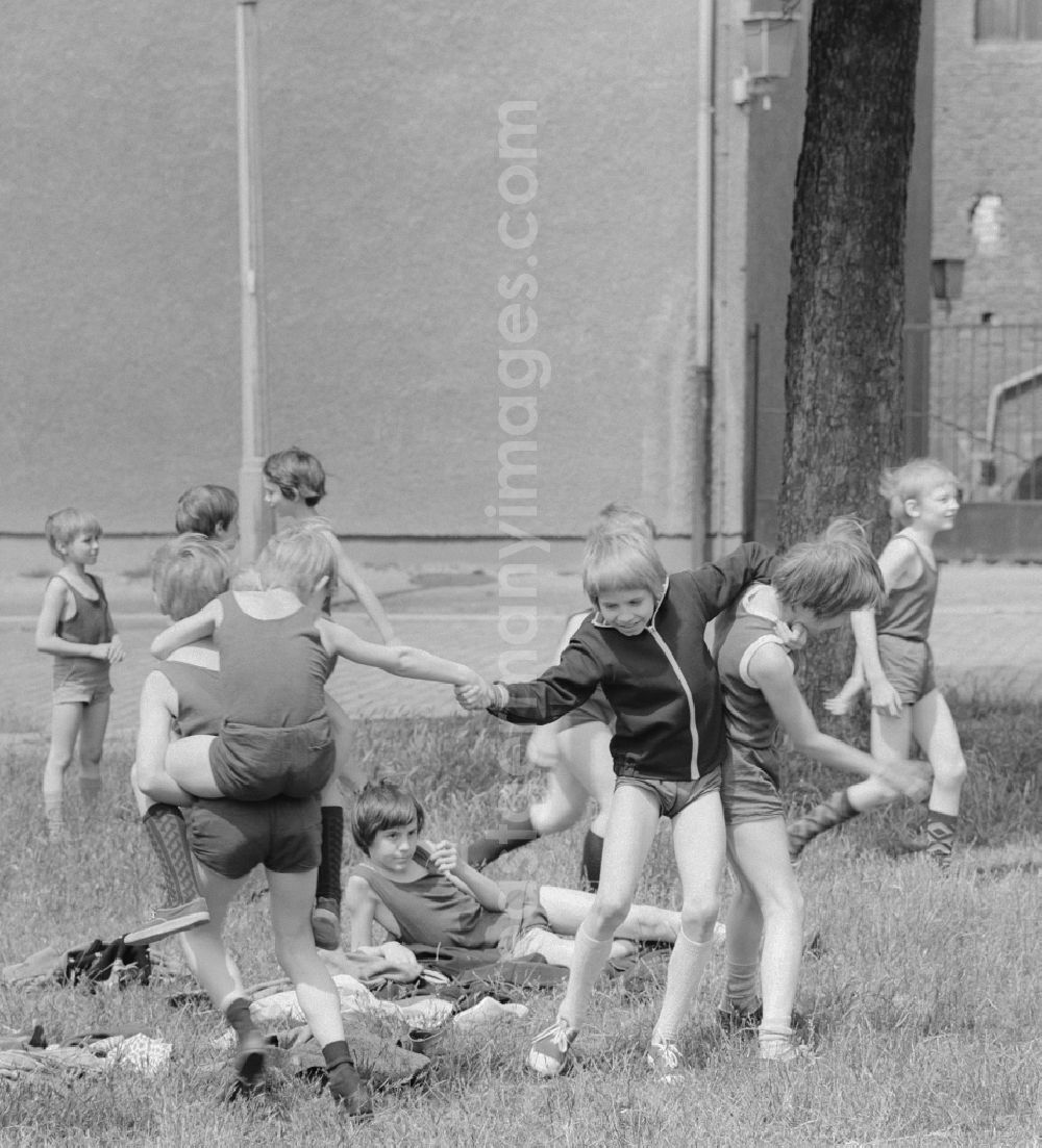GDR photo archive: Berlin - Children playing on a meadow in Berlin