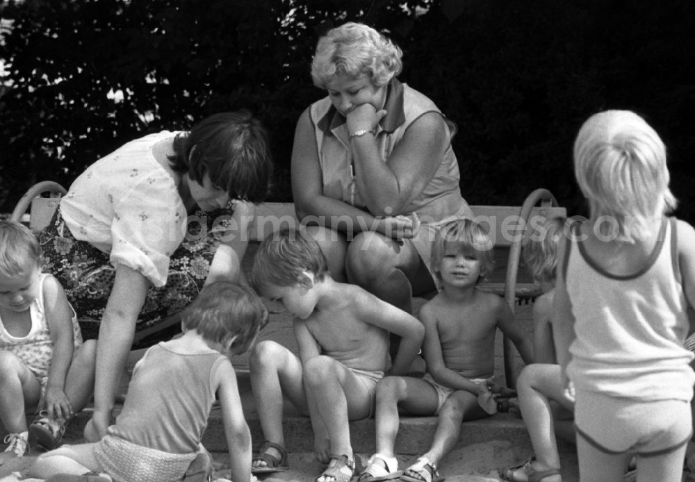 Berlin: Children in the garden of the kindergarten in summer in Berlin Eastberlin on the territory of the former GDR, German Democratic Republic