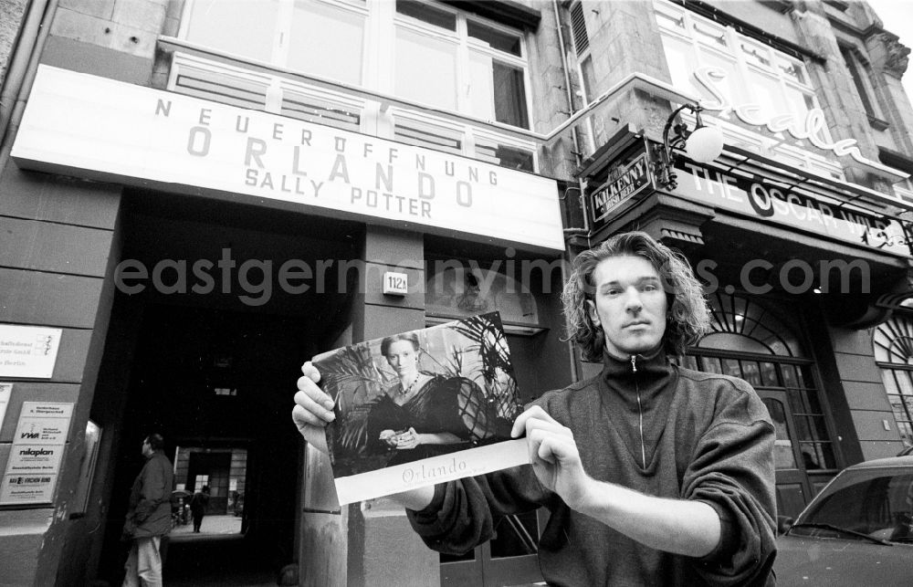 GDR photo archive: Berlin - New opening of the Scala cinema - building front at Friedrichstrasse 112 a Friedrichstrasse in the district Mitte in Berlin, Germany. Sign saying New opening Orlando Sally Potter above the entrance next to The Oscar Wilde Traditional Irish Bar