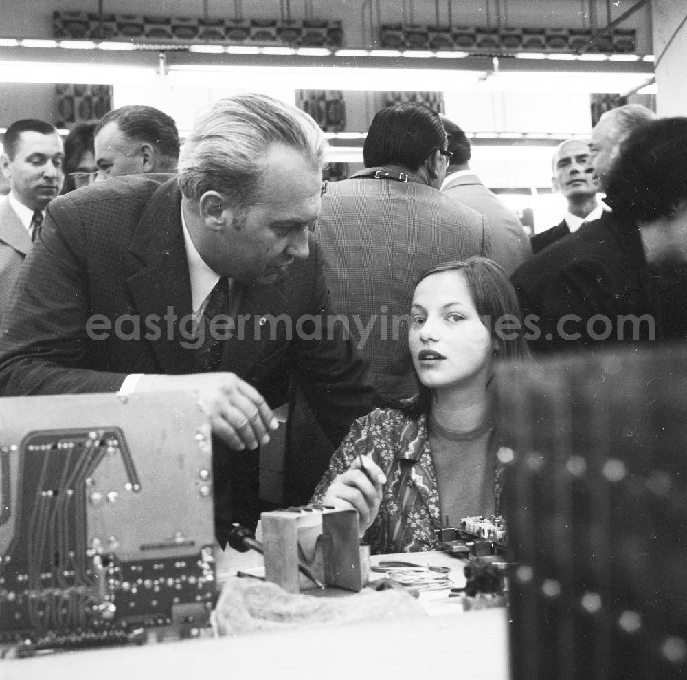 Berlin: Konrad Naumann (1928-1992), 1st secretary of the district management SED Berlin and member of the Politburo of the central committee of the SED in the GDR, for visit in the radio work VEB Koepenick in Berlin, the former capital of the GDR, German democratic republic