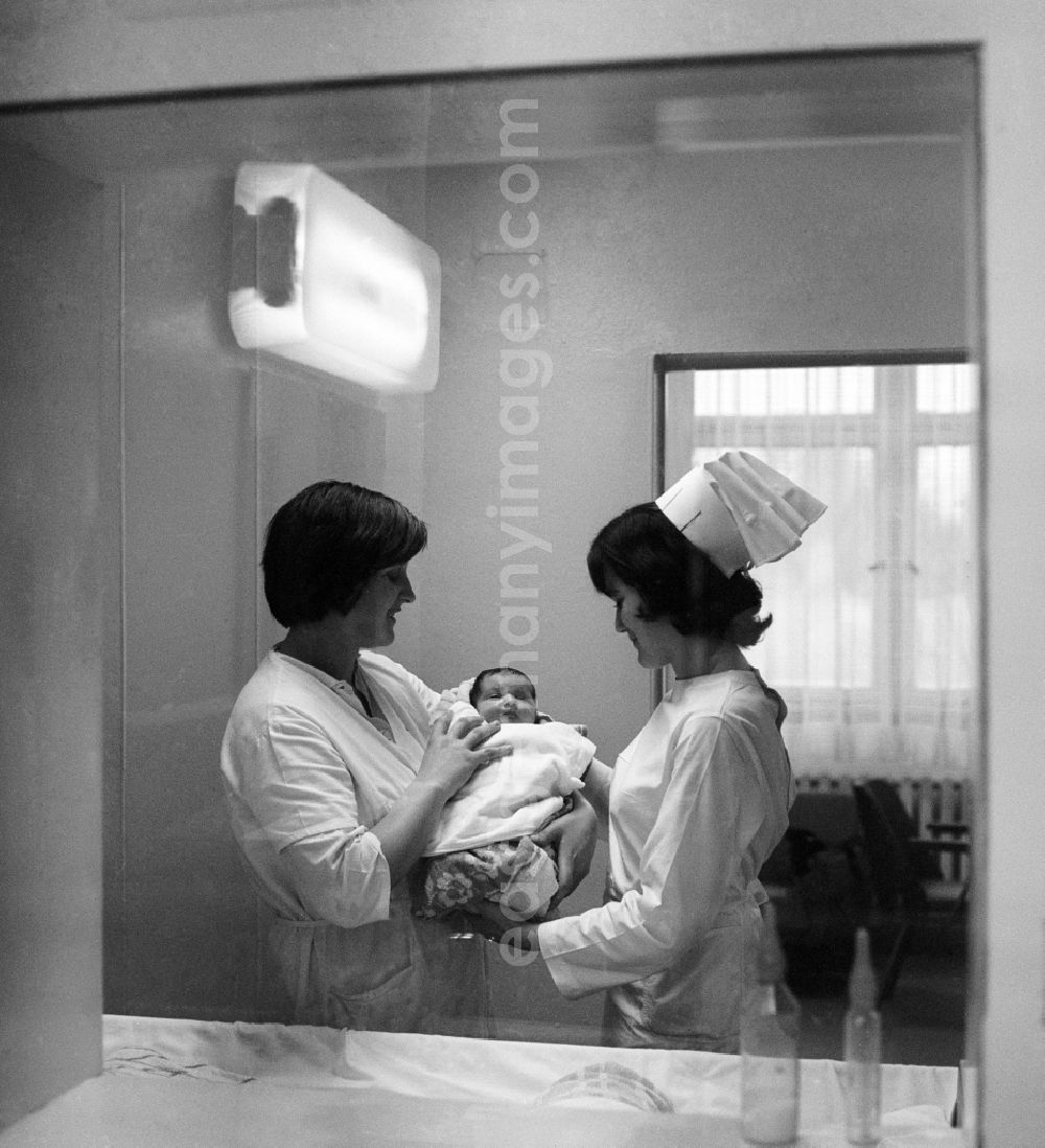 GDR photo archive: Bad Saarow - Two nurses in a neonatal unit in Bad Saarow in Brandenburg on the territory of the former GDR, German Democratic Republic