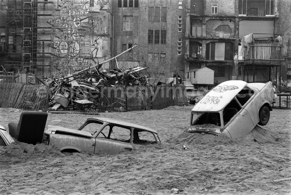 GDR photo archive: Berlin - Trabant cars in front of the occupied Kunsthaus Tacheles in Oranienburger Strasse in Berlin - Mitte, the former capital of the GDR, German Democratic Republic