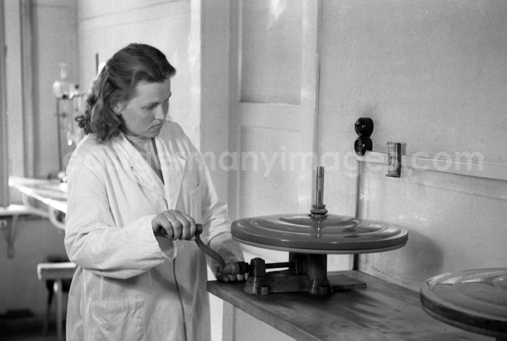 GDR picture archive: Dresden - Laboratory assistant in a white coat operates a centrifuge in an publicly owned property animal breeding in Pillnitz in Dresden in the state Saxony on the territory of the former GDR, German Democratic Republic