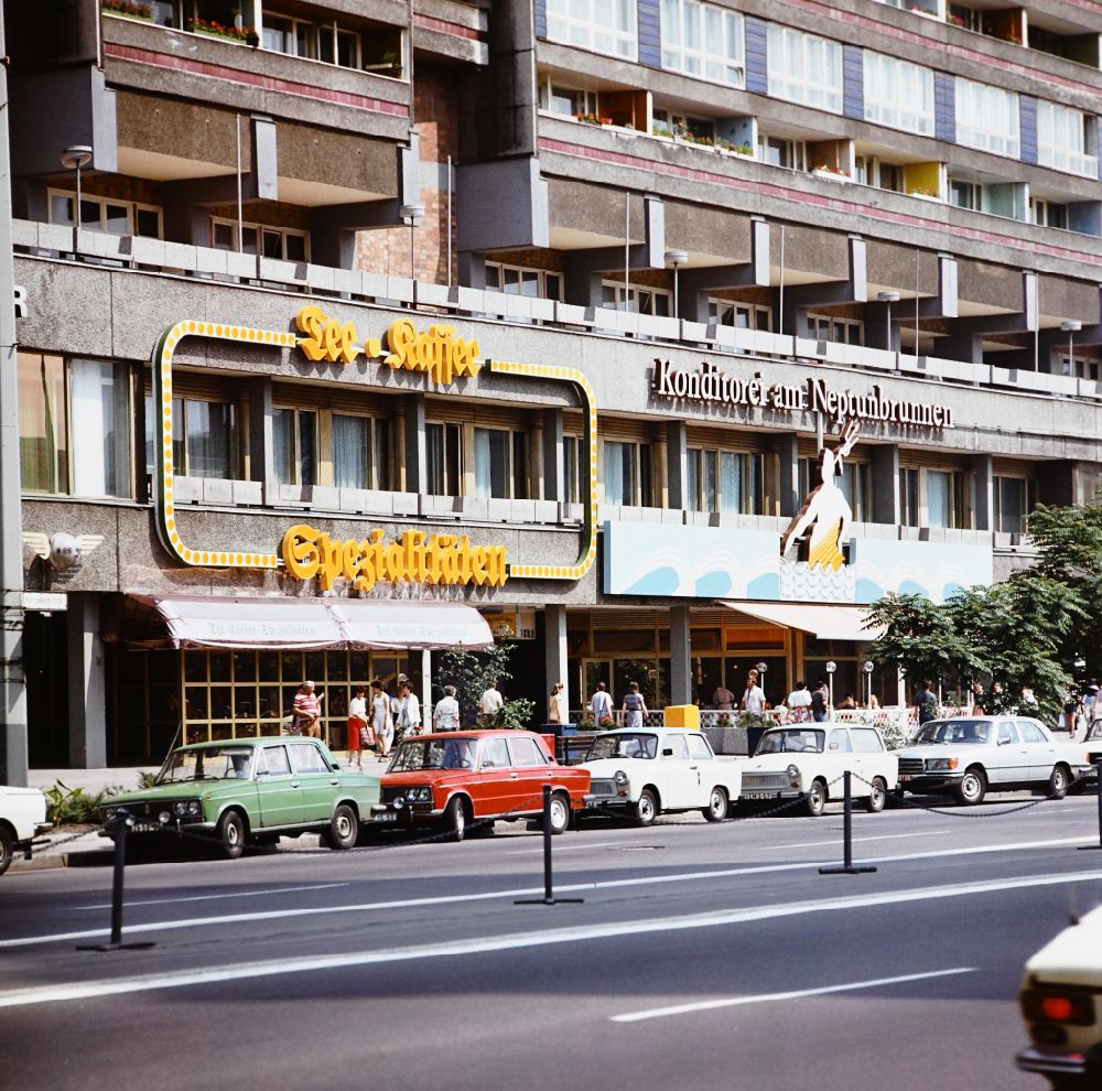 GDR photo archive: Berlin - Café and pastry shop on Karl-Liebknecht-Strasse in the Mitte district of Berlin East Berlin on the territory of the former GDR, German Democratic Republic. Car models Lada, Trabant and Mercedes parked on the road wheel