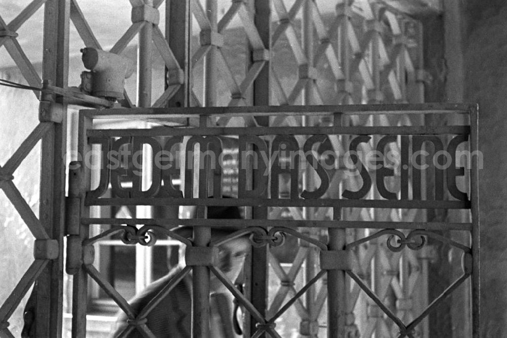 GDR photo archive: Buchenwald - Ein Besucher geht durch das Lagertor des ehemaligen Konzentrationslager Buchenwald mit der Inschrift Jedem das Seine. In den 5