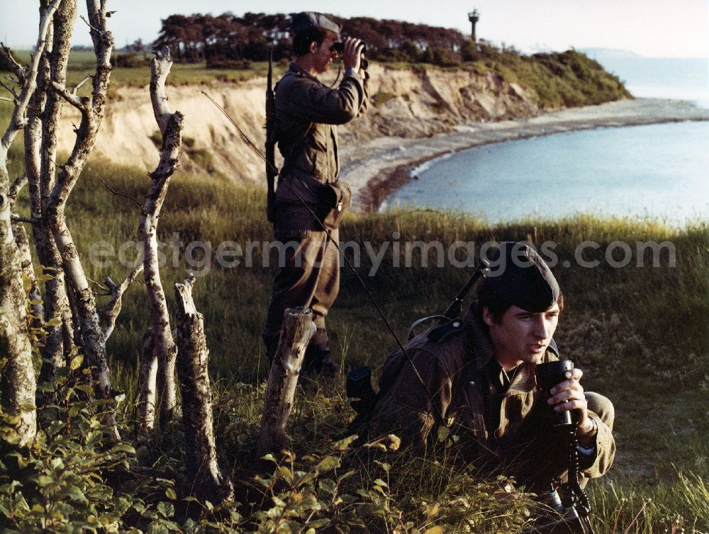 GDR picture archive: Sassnitz - Landside border control of the Baltic Sea coast by members of the border brigade Coast of East German border guards. Here to see a pair of guards, equipped with machine gun AK-47
