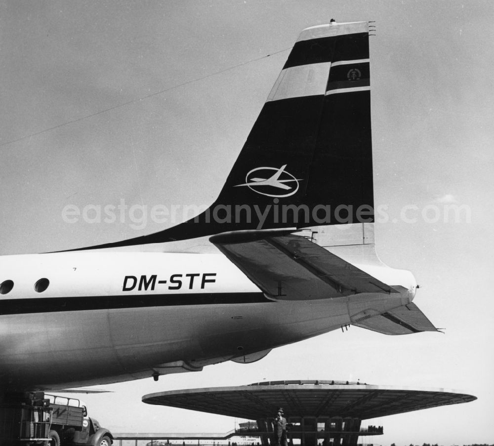 GDR photo archive: Moskau - A tail of IL-18 with the identifier DM-STF Airline INTERFLUG at the Sheremetyevo International Airport outside Terminal B in Moscow in Russia