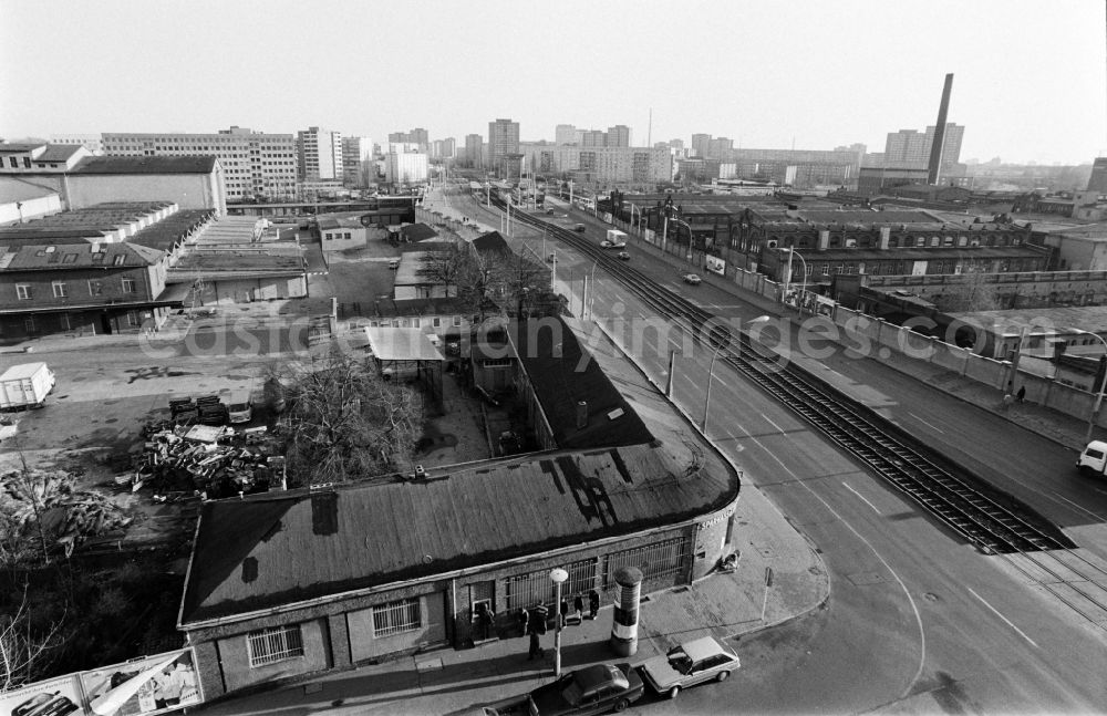 GDR image archive: Berlin - Leninallee (today Landsberger Allee ) with the production facilities and production equipment of the municipal slaughterhouse (r.) and view of the prefabricated buildings in Berlin - Friedrichshain and Lichtenberg, the former capital of the GDR, German Democratic Republic