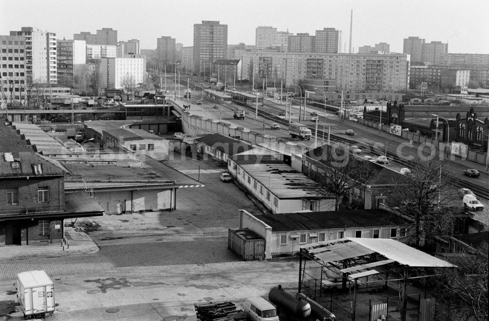 GDR photo archive: Berlin - Leninallee (today Landsberger Allee ) with the production facilities and production equipment of the municipal slaughterhouse (r.) and view of the prefabricated buildings in Berlin - Friedrichshain and Lichtenberg, the former capital of the GDR, German Democratic Republic