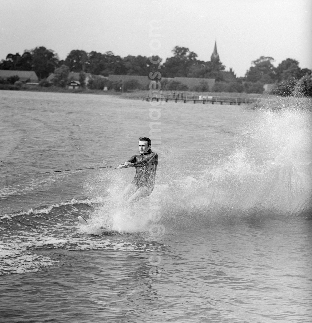 GDR photo archive: Kablow - Man rides water skiing on the Kruepelsee in Kablow in today's federal state of Brandenburg