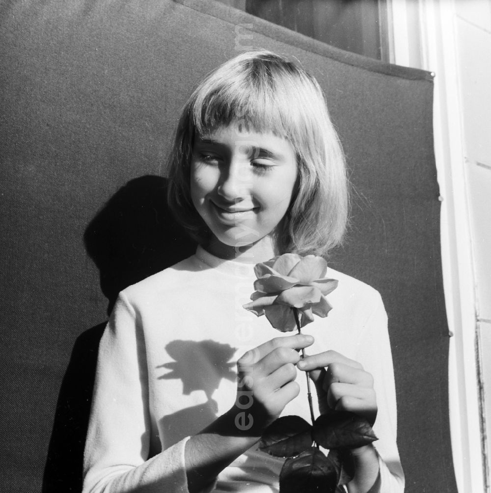 GDR image archive: Berlin - Girl with a rose in her hand in Berlin, the former capital of the GDR, German Democratic Republic