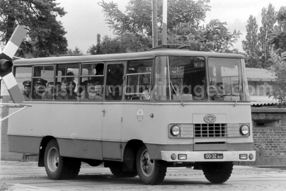 GDR photo archive: Wünsdorf - Soviet soldiers in uniform of the Red Army of the GSSD Group of Soviet Forces in Germany ride in a minibus military vehicle Progress-3