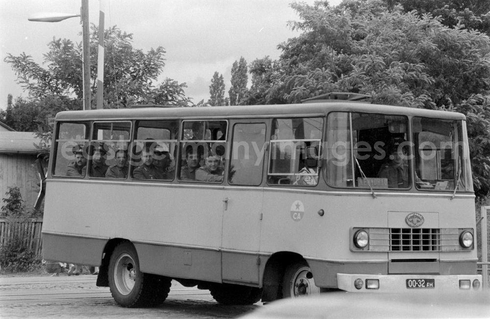 GDR picture archive: Wünsdorf - Soviet soldiers in uniform of the Red Army of the GSSD Group of Soviet Forces in Germany ride in a minibus military vehicle Progress-3