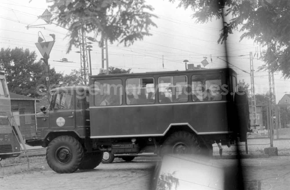 GDR image archive: Wünsdorf - Soviet soldiers in uniform of the Red Army of the GSSD Group of Soviet Forces in Germany ride in a minibus military vehicle Progress-3