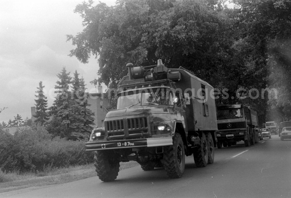 GDR picture archive: Wünsdorf - Truck - truck as a military vehicle vom Typ KamAZ und ZIL der GSSD in Wuensdorf in the state Brandenburg on the territory of the former GDR, German Democratic Republic