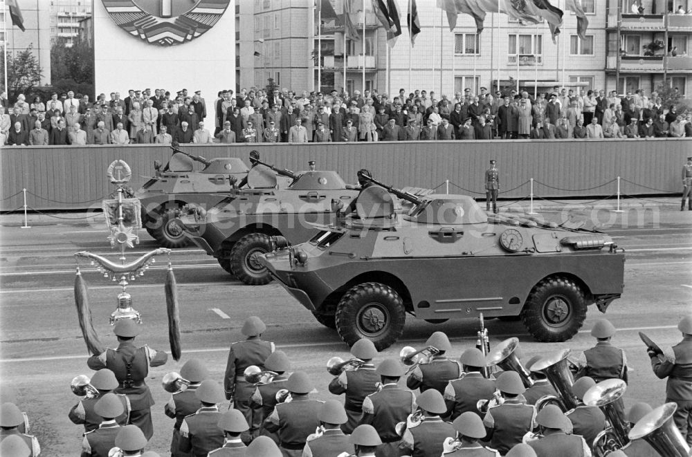 GDR image archive: Berlin - Parade formation and march of soldiers and officers on the parade of honour with motorised land forces units including tanks of the NVA National People's Army in Karl-Marx-Allee in the Mitte district of Berlin, the former capital of the GDR, German Democratic Republic