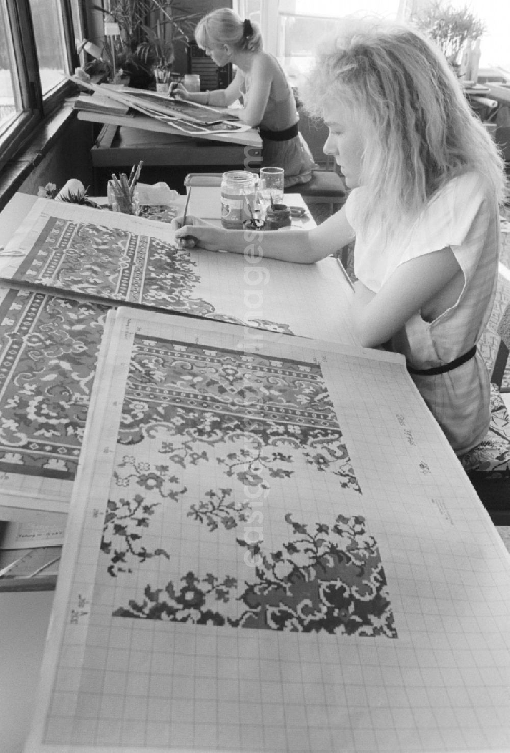 GDR picture archive: Malchow - Employees of the development department of VEB Carpet Factory North Malchow in Malchow in Mecklenburg-Western Pomerania in the field of the former GDR, German Democratic Republic. Here new patterns are designed for carpets
