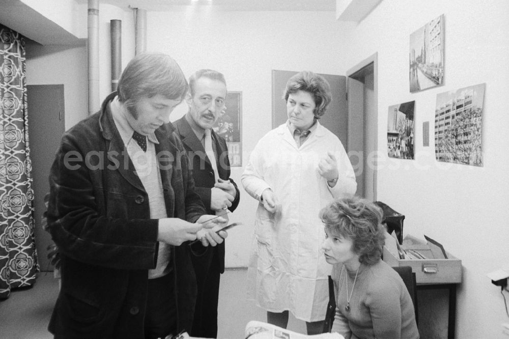 GDR photo archive: Berlin - Employees in the photo lab of the daily newspaper ND - New Germany - in Berlin, the former capital of the GDR, the German Democratic Republic. From left: the photographer Siegfried Bonitz and Heinz Schonfeld beside the photo-lab technician Barbara Rucht