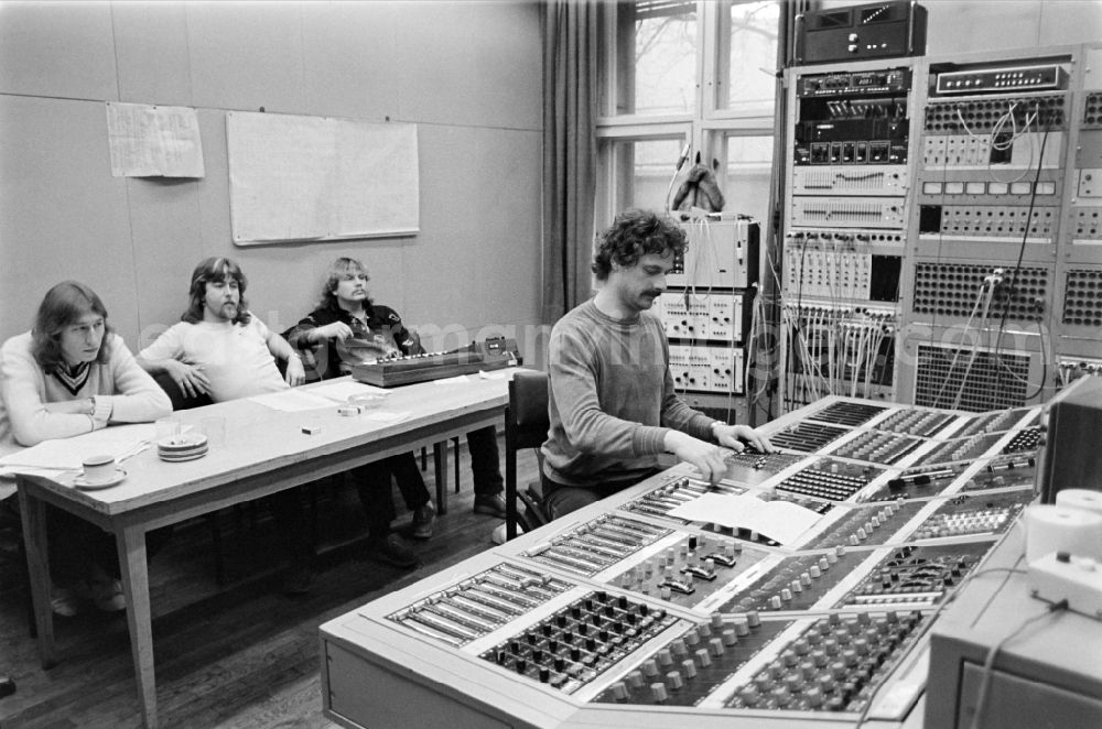 GDR photo archive: Berlin - Band members of the band Karat sit in front of the electronic equipment in a recording studio of the record label AMIGA of VEB Deutsche Schallplatten in East Berlin in the territory of the former GDR, German Democratic Republic