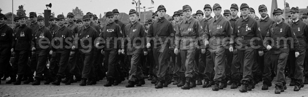 GDR photo archive: Berlin Mitte - The members of the fighting groups of the working class during the advance to the VIP stand to fight and holiday of the 1st On May Schlossplatz in Berlin - Mitte