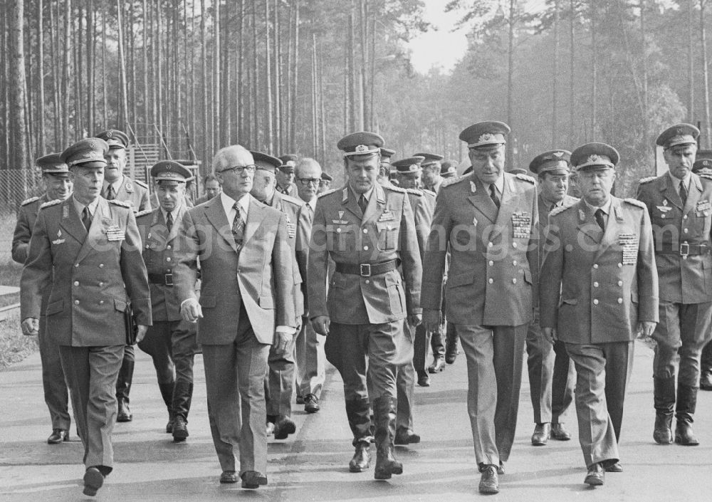 GDR image archive: Peenemünde - Members of the Politburo of the SED Central Committee to visit the Jagdfliegergeschwader 9 (JG-9) in Peenemuende in Mecklenburg-Western Pomerania in the field of the former GDR, German Democratic Republic. From left to right: the Minister of State Security Erich Fritz Emil Mielke (1907 - 2000), army general Karl-Heinz Hoffmann (1910 - 1985), unknown, the general secretary of the Central Committee (ZK) of the SED Erich Honecker (1912 - 1994) and the Deputy Minister of National Defence and chief of the command LSK / LV air Force / air Defense of the National People's Army NVA Wolfgang Reinhold (1923 - 2