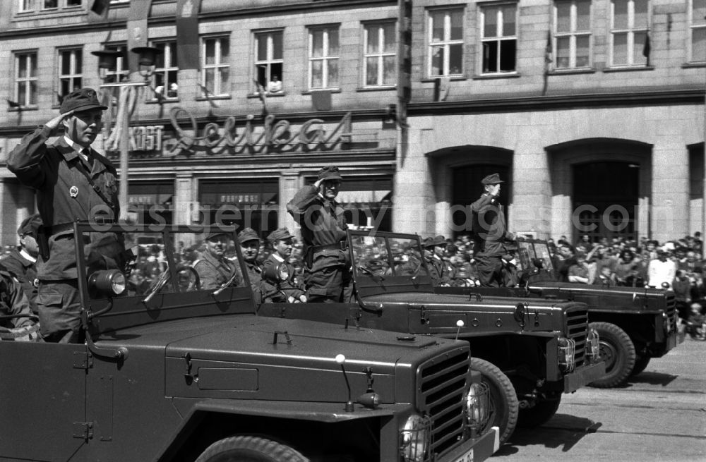 GDR picture archive: Magdeburg - Uniformed and motorized units of the combat groups of the GDR at the parade on May 1 in Magdeburg. Here when passing with a military salute