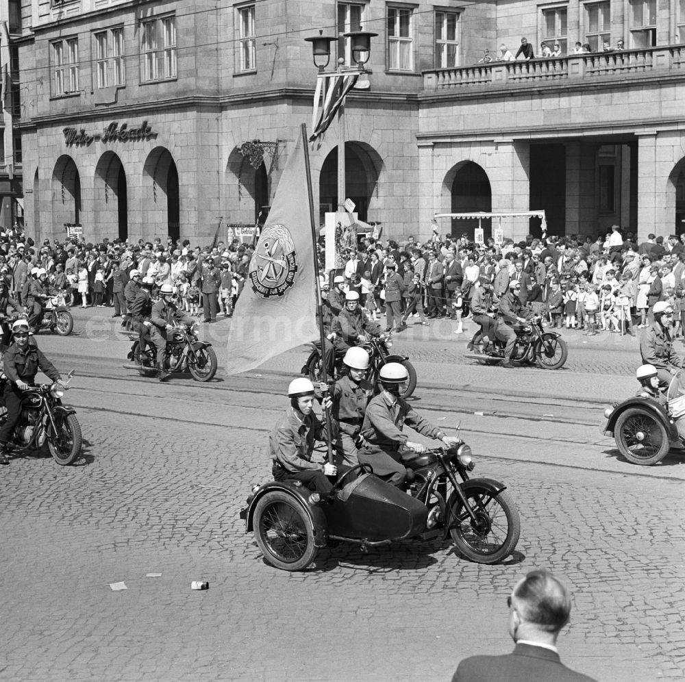 GDR photo archive: Magdeburg - Motorcycle column of GST, Society for Sport and Technology, on the 1st of May demonstration in Magdeburg in Saxony Anhalt