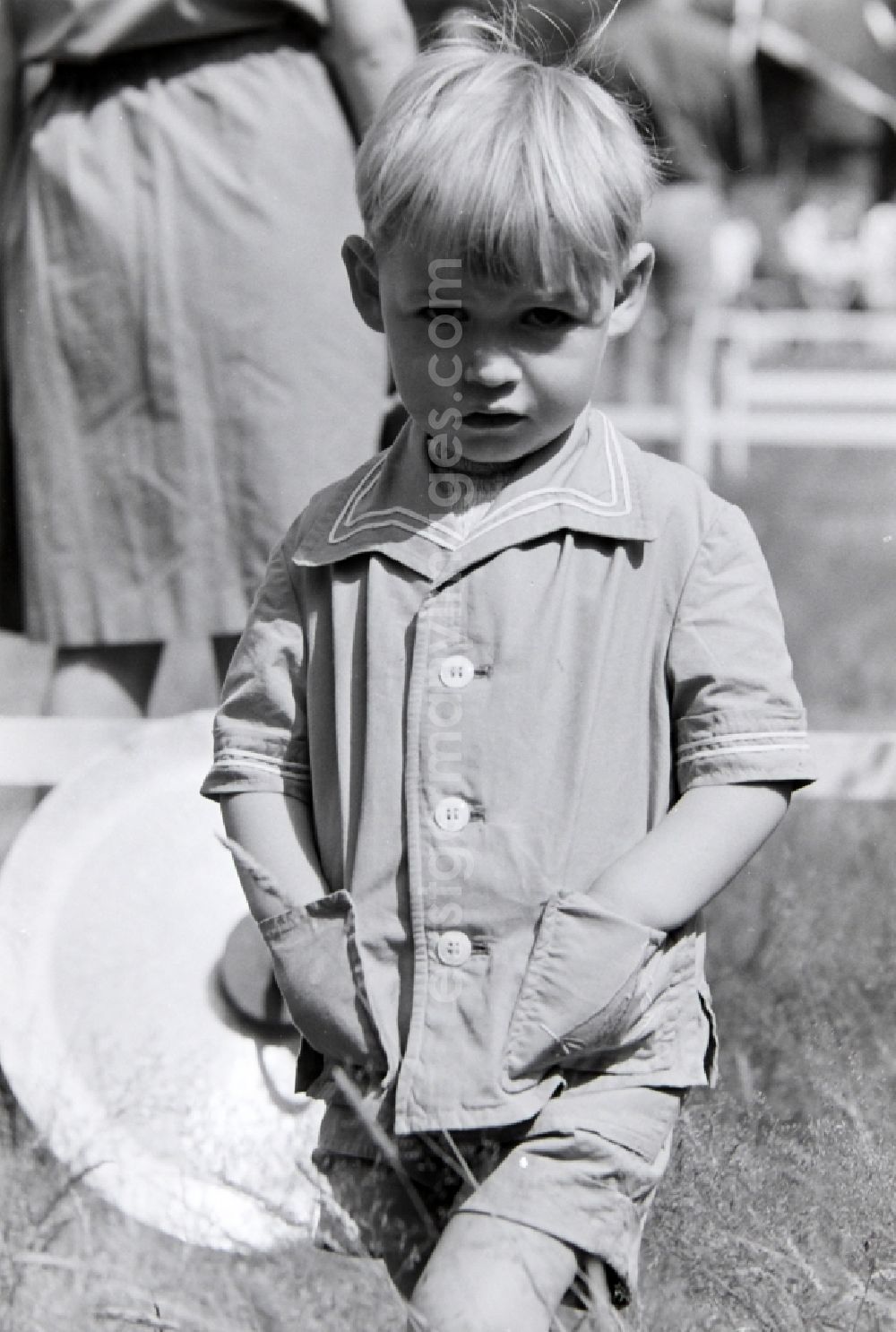 GDR picture archive: Prerow - Young boy interested in music at the summer camp Kim Ir Sen of the pioneer organization Ernst Thaelmann in Prerow in the state of Mecklenburg-Western Pomerania in the area of the former GDR, German Democratic Republic