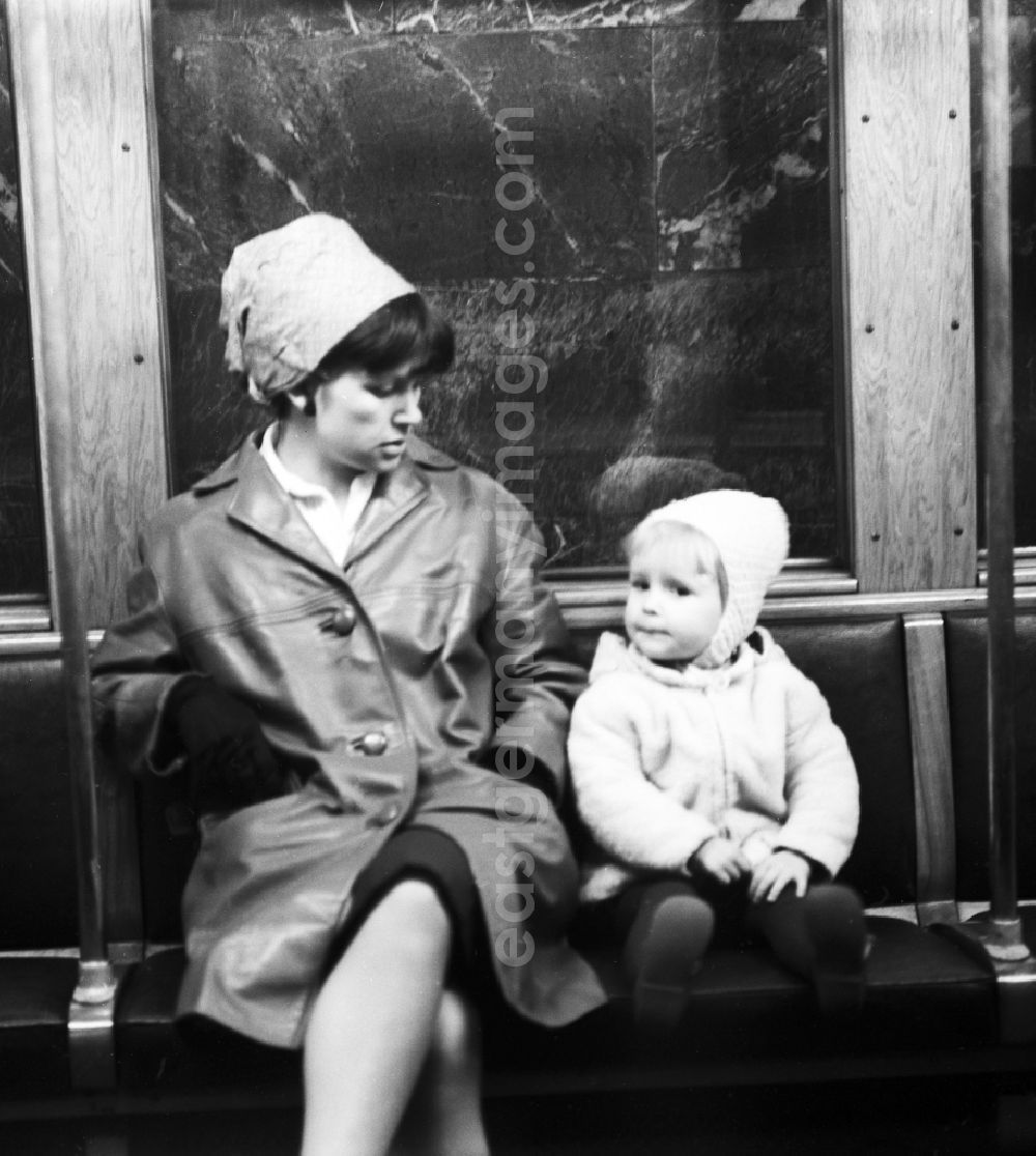 Berlin: A mother sits with her child in the subway in Berlin, the former capital of the GDR, the German Democratic Republic
