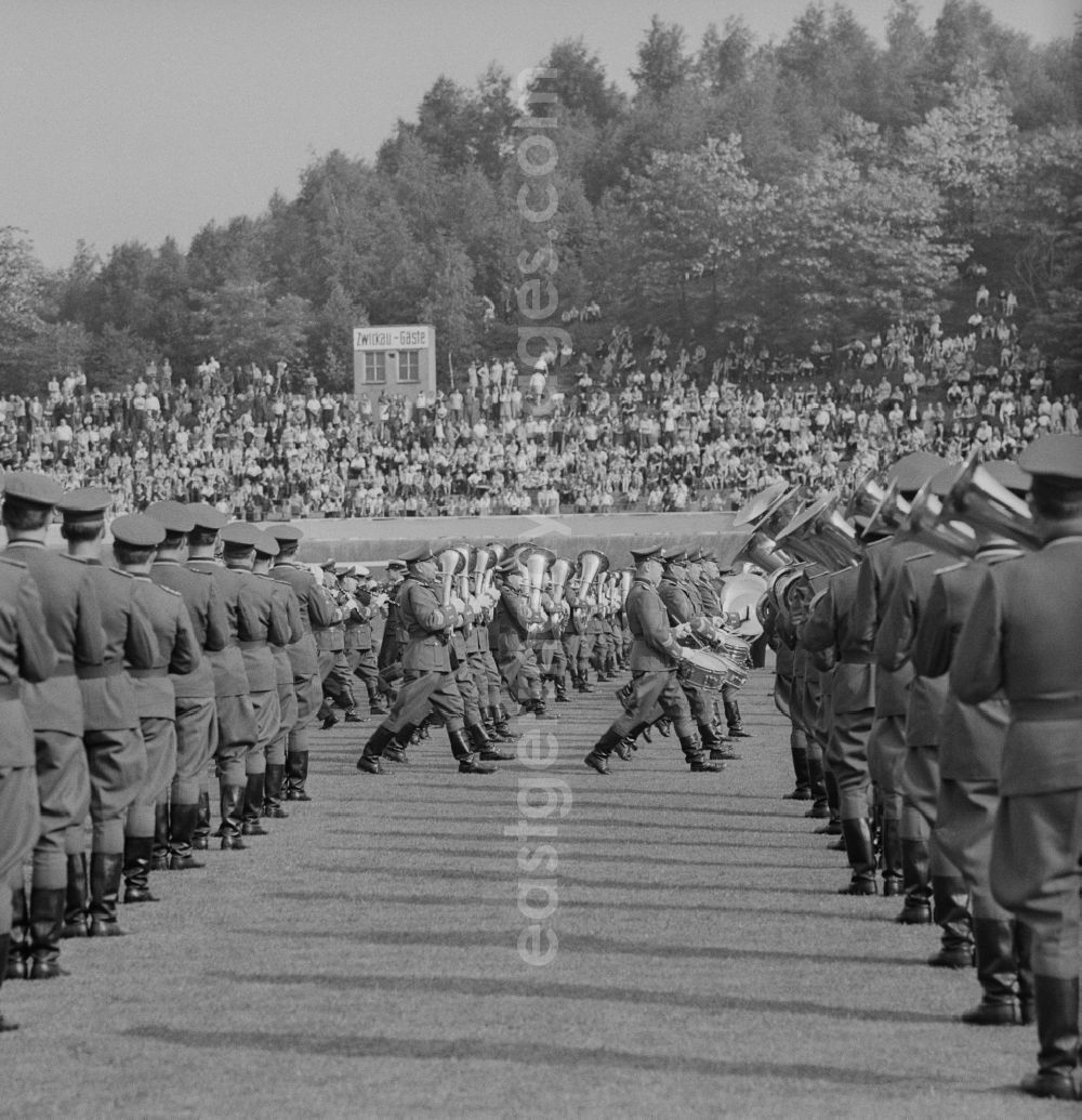 GDR picture archive: Chemnitz - NVA military band playing in a stadium before an audience in Chemnitz in Saxony today