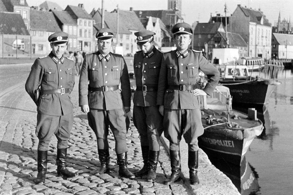 Wismar: Harbor police ships lying at anchor and moored with crew officers in the city harbor on Lagerstrasse in Wismar, Mecklenburg-Western Pomerania in the territory of the former GDR, German Democratic Republic