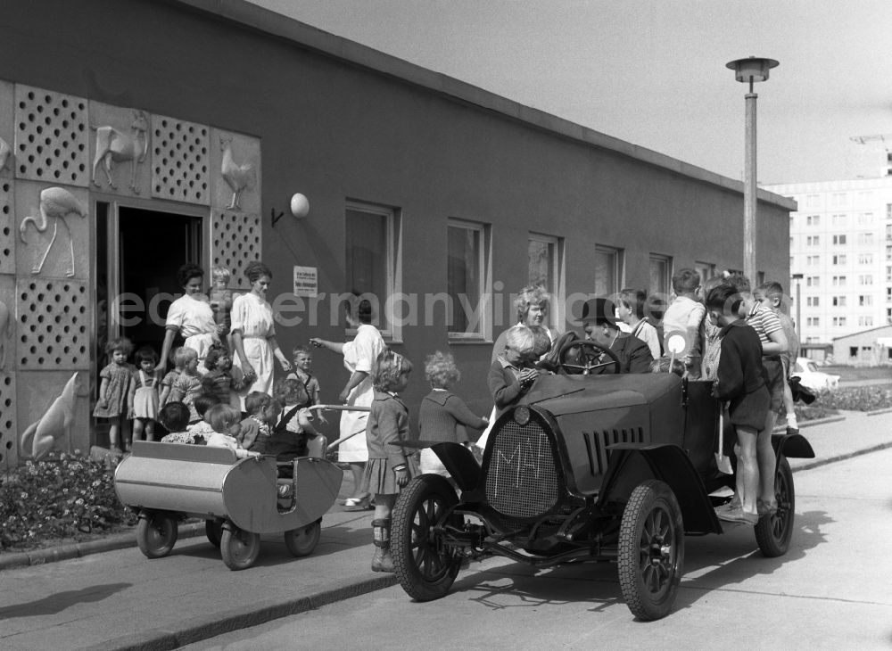 GDR picture archive: Berlin - Vintage car F5 from the automobile manufacturer MAF in front of a kindergarten in Berlin-Mitte in the area of the former GDR, German Democratic Republic