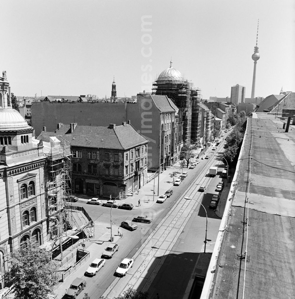 Berlin: View of the Oranienburger Strasse towards the city center with New Synagogue during the construction works and TV tower in the background in Berlin - Mitte, the former capital of the GDR, German Democratic Republic