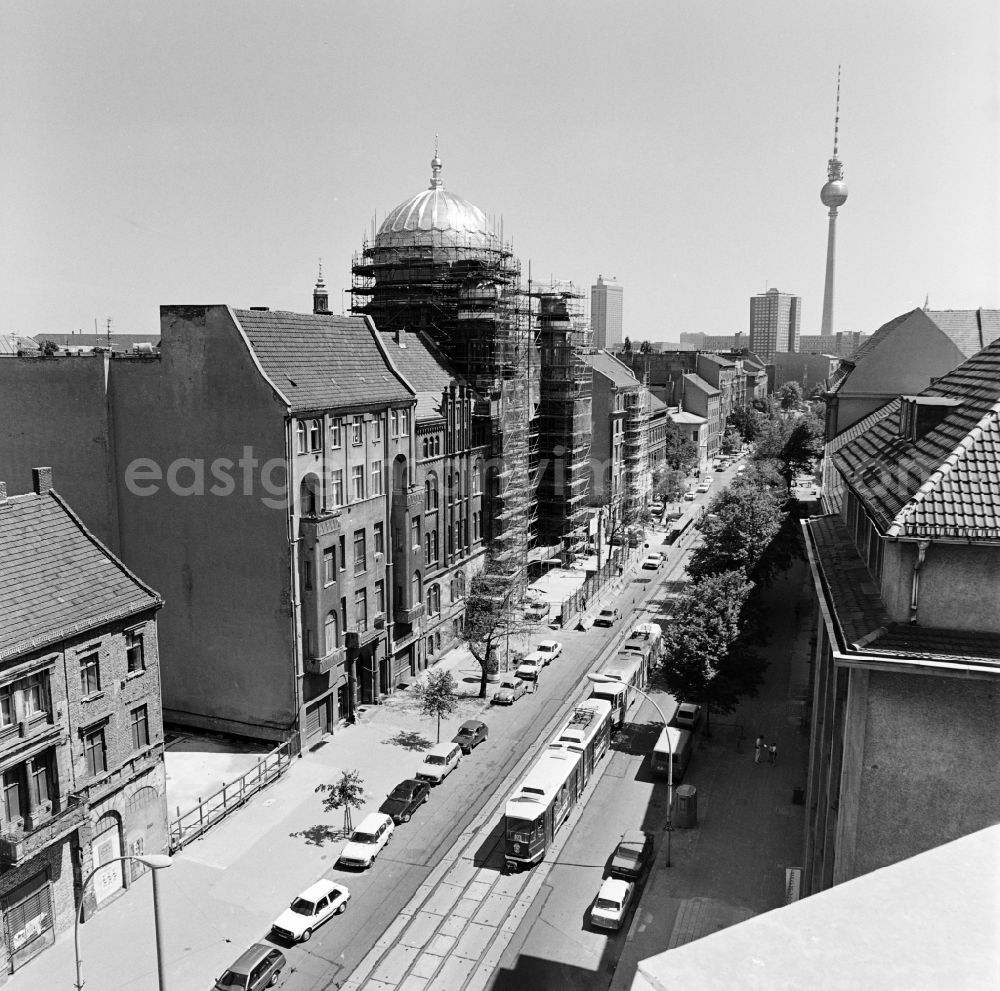 GDR image archive: Berlin - View of the Oranienburger Strasse towards the city center with New Synagogue during the construction works and TV tower in the background in Berlin - Mitte, the former capital of the GDR, German Democratic Republic