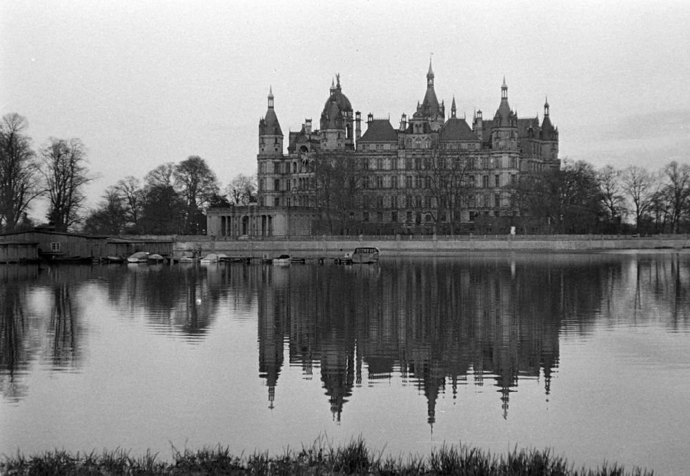 Schwerin: Palace with reflection in the water on street Lennestrasse in Schwerin, Mecklenburg-Western Pomerania on the territory of the former GDR, German Democratic Republic