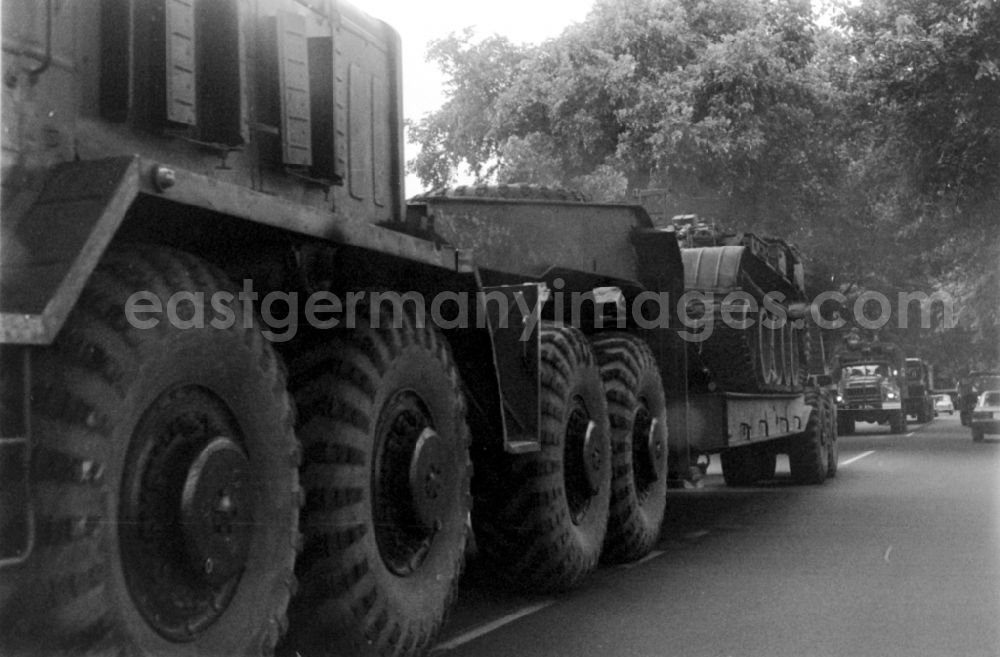 GDR photo archive: Wünsdorf - Tank weapon system of the military and combat technology of the GSSD Group of the Soviet Armed Forces in Germany loaded onto a low loader in Wuensdorf in the federal state of Brandenburg in the area of the former GDR, German Democratic Republic
