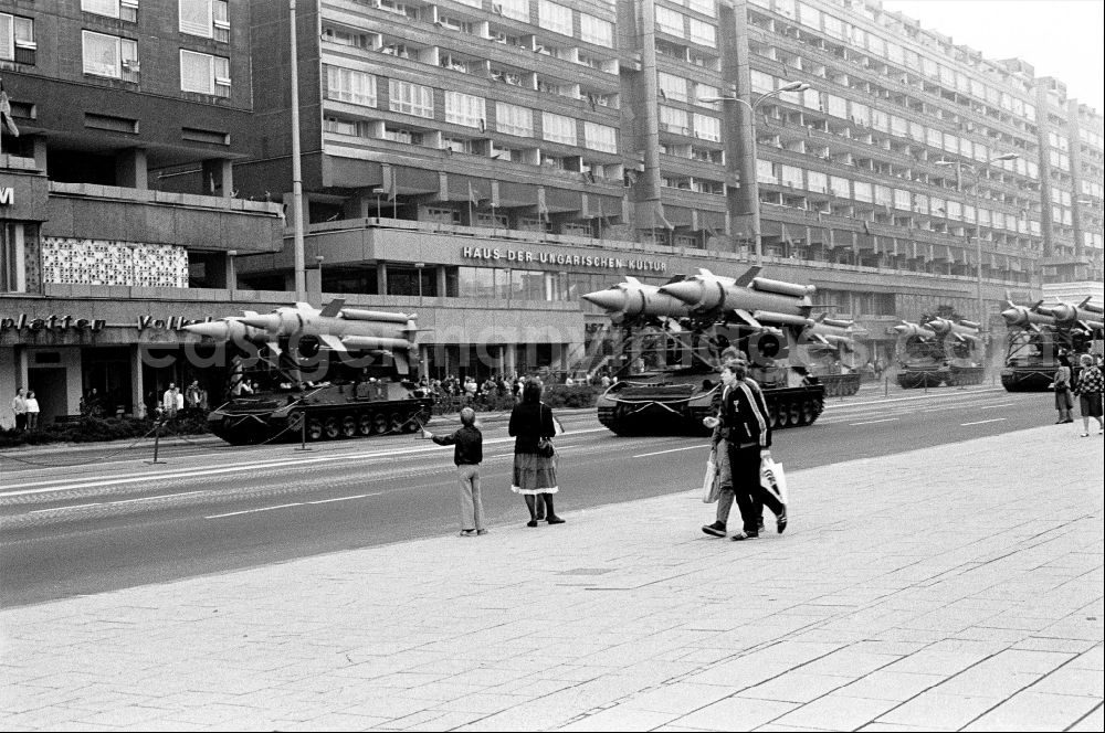 GDR picture archive: Berlin - Parade ride of military and combat technology of mobile anti-aircraft systems on a tracked vehicle with two-stage radar-guided 3M8 anti-aircraft missiles of the NVA National Peoples Army on Karl-Liebknecht-Strasse in the Mitte district of Berlin East Berlin on the territory of the former GDR, German Democratic Republic