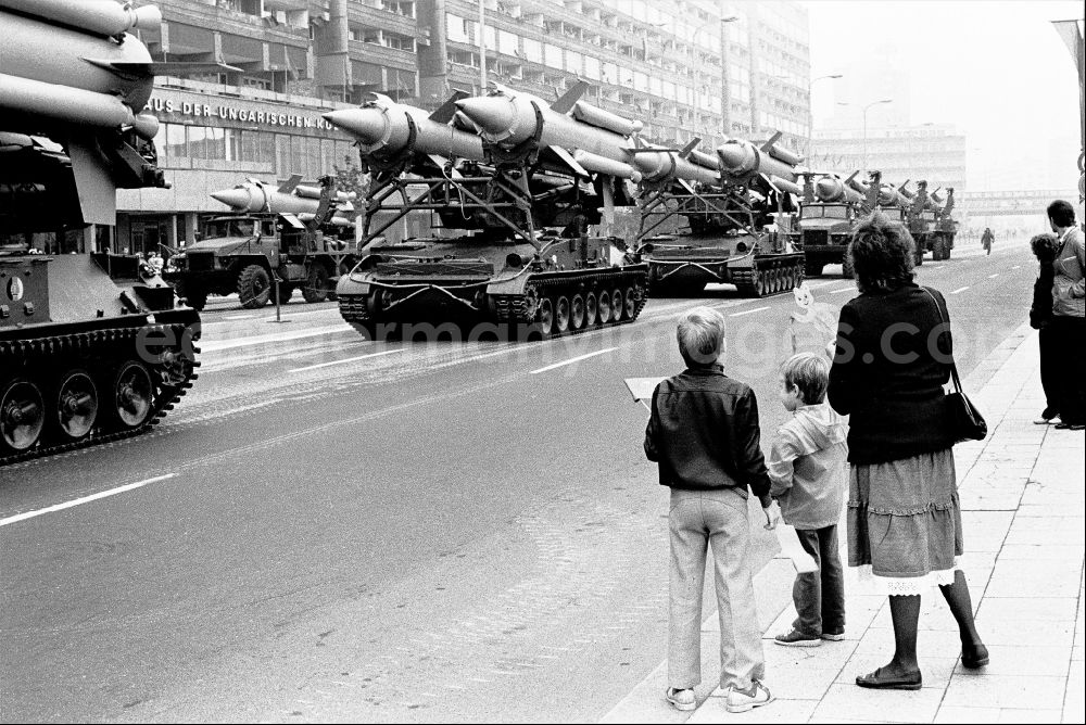 GDR image archive: Berlin - Parade ride of military and combat technology of mobile anti-aircraft systems on a tracked vehicle with two-stage radar-guided 3M8 anti-aircraft missiles of the NVA National Peoples Army on Karl-Liebknecht-Strasse in the Mitte district of Berlin East Berlin on the territory of the former GDR, German Democratic Republic