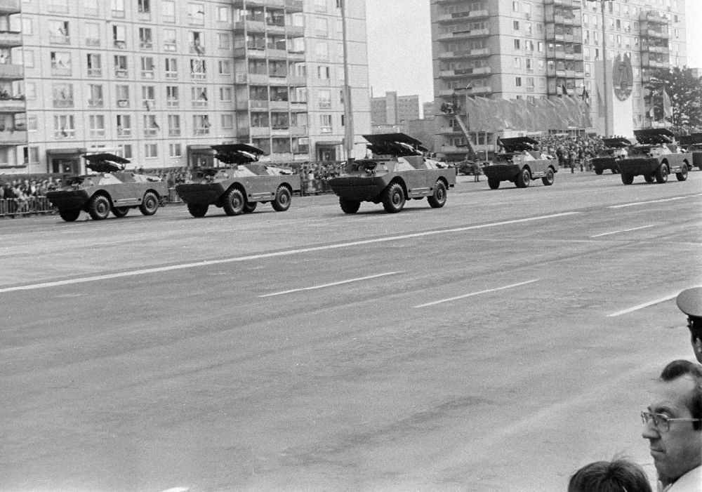 GDR photo archive: Berlin - Parade ride of military and combat technology Spaehpanzer BRDM-1 projectile launchers - rocket launchers of the NVA National People's Army on the street Karl-Marx-Allee in the Mitte district of Berlin East Berlin on the territory of the former GDR, German Democratic Republic