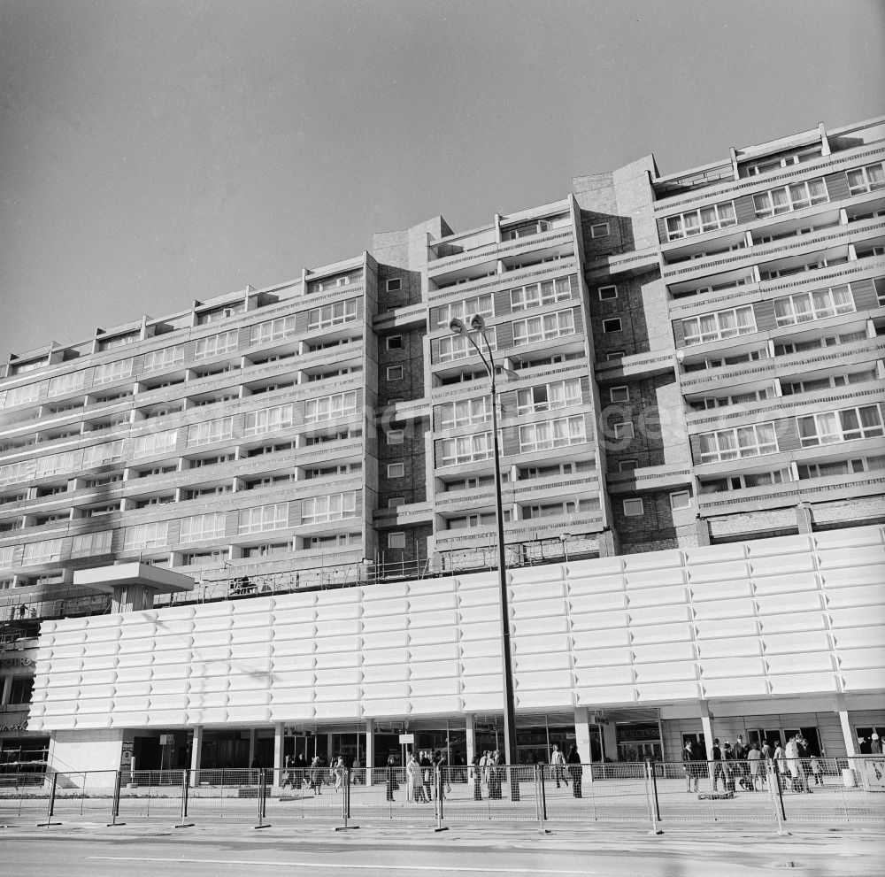 GDR photo archive: Berlin - Prefabricated building flats and retail stores in the Karl's Liebknecht street in Berlin, the former capital of the GDR, German democratic republic