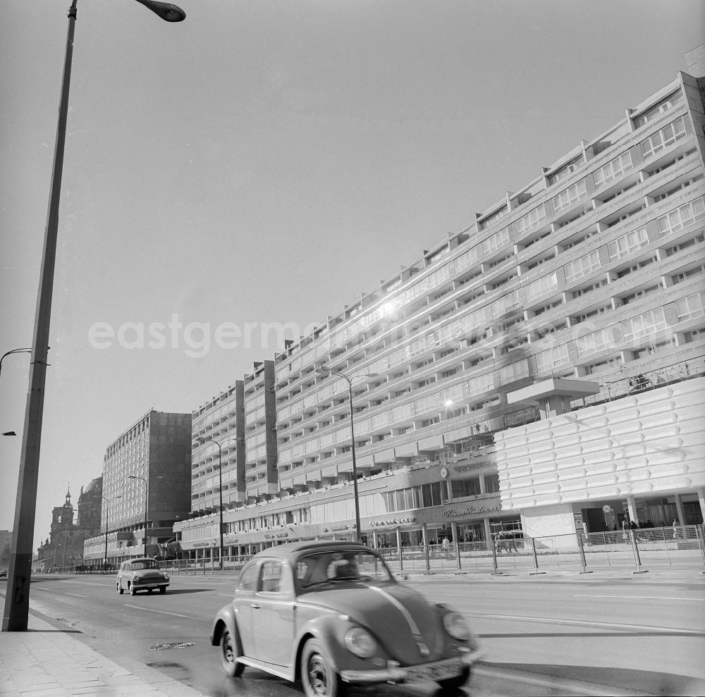 GDR picture archive: Berlin - Prefabricated building flats and retail stores in the Karl's Liebknecht street in Berlin, the former capital of the GDR, German democratic republic