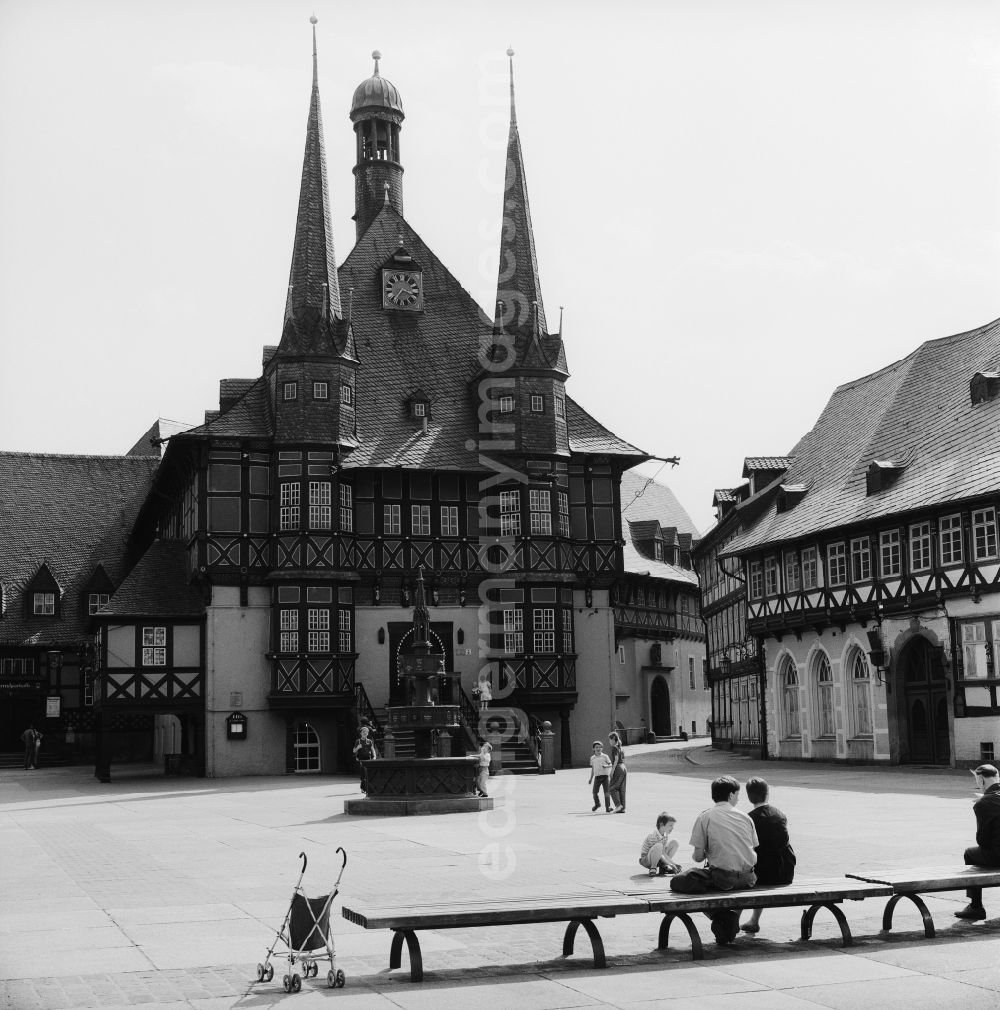 GDR picture archive: Wernigerode - The historic town hall on the market square with the Wohltaeterbrunnen in Wernigerode in the federal state of Saxony-Anhalt on the territory of the former GDR, German Democratic Republic