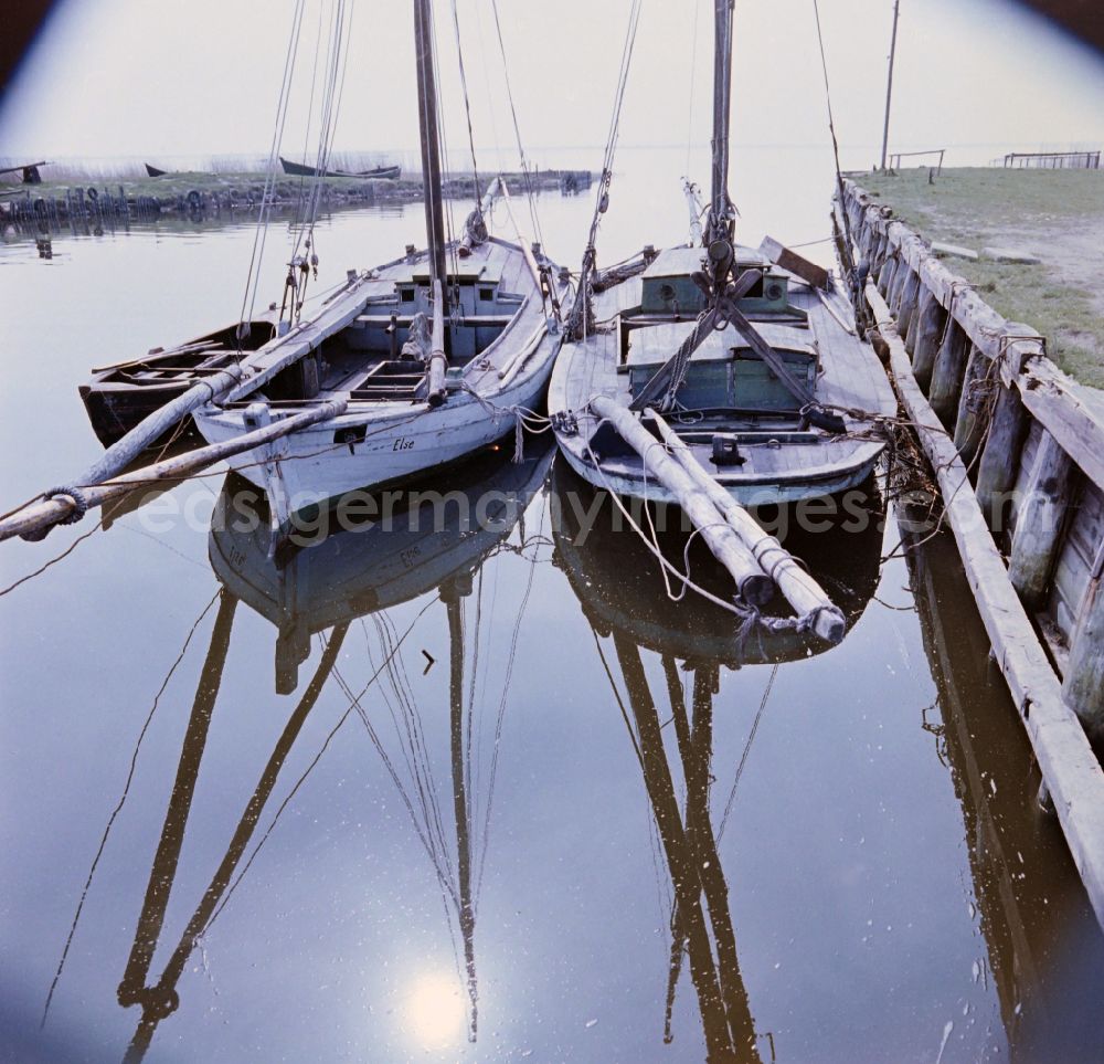 GDR picture archive: Ahrenshoop - Ships at a harbour at the Bodden near Ahrenshoop in the state Mecklenburg-Western Pomerania on the territory of the former GDR, German Democratic Republic