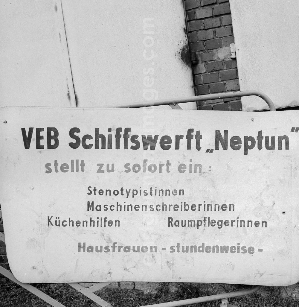 Rostock: Sign of the dockyard VEB Neptune about open jobs in Rostock in the federal state Mecklenburg-West Pomerania in the area of the former GDR, German democratic republic. Shorthand typists, Machines writers, culinary facilities, cleaners and housewives are searched (by the hour)