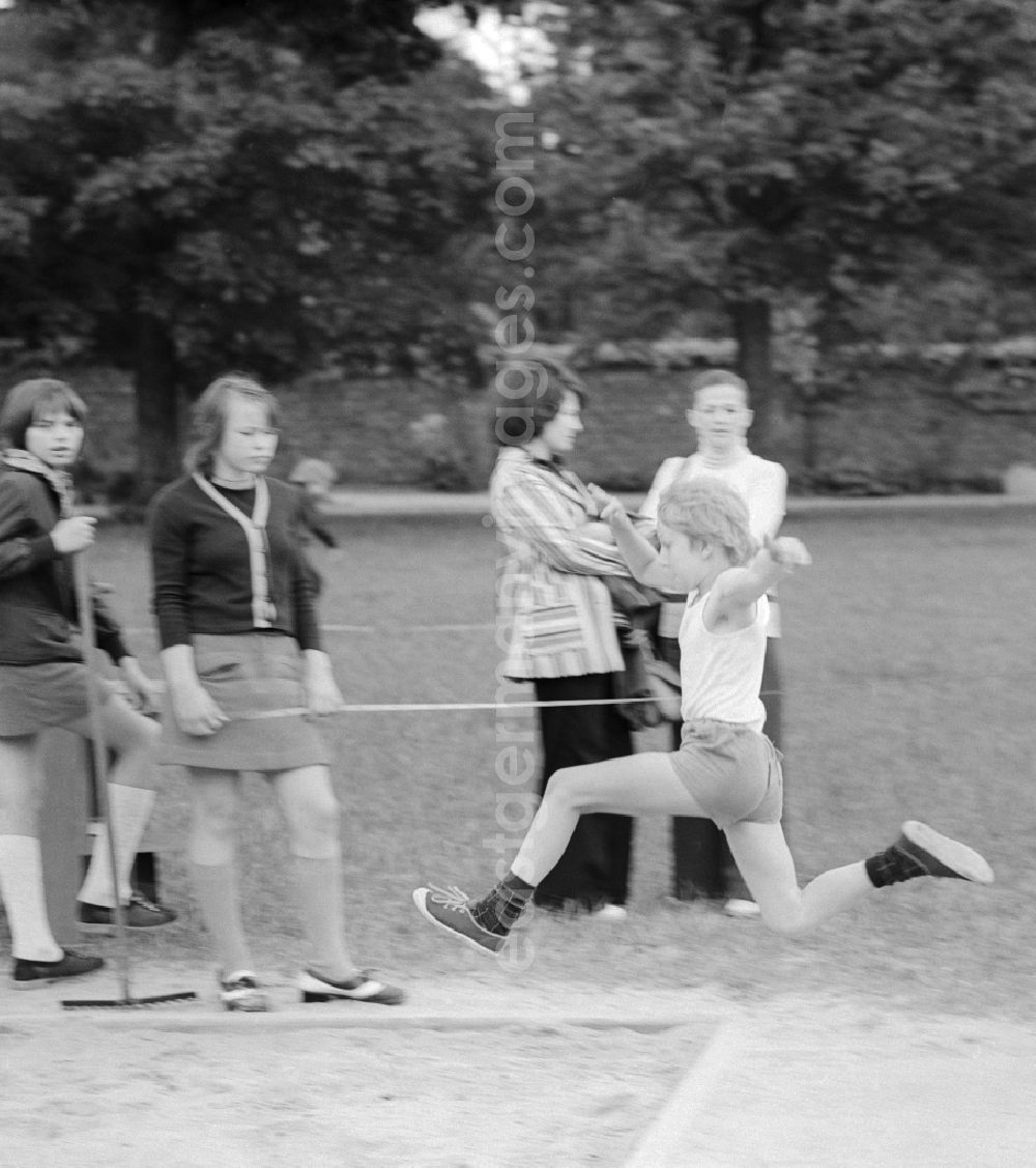 GDR photo archive: Berlin - Students in Long Jump at the school sports festival in Berlin