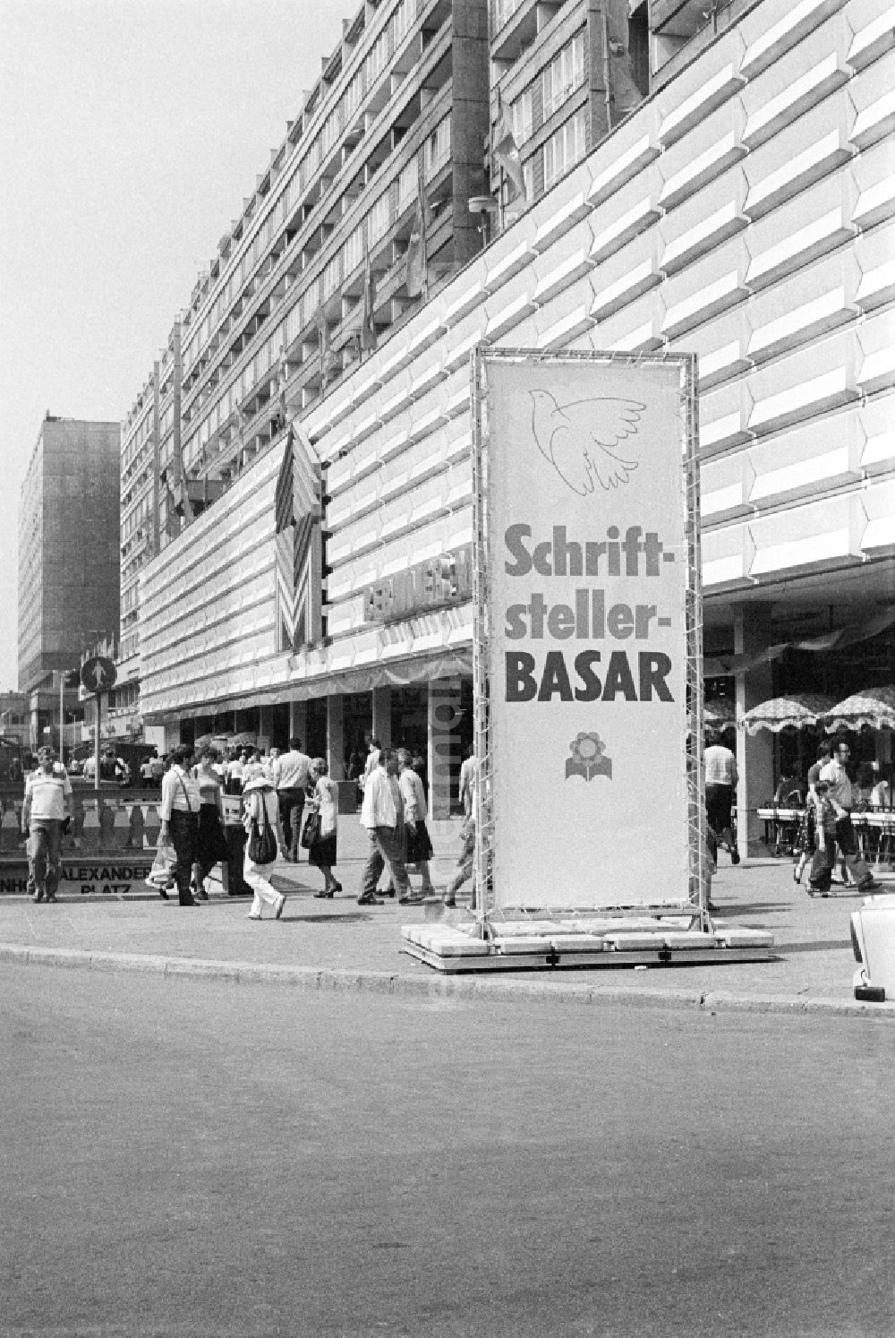 Berlin: Advertising board with the inscription Writers' Bazaar in front of the market hall on Alexanderplatz on the occasion of the National Youth Festival in East Berlin on the territory of the former GDR, German Democratic Republic