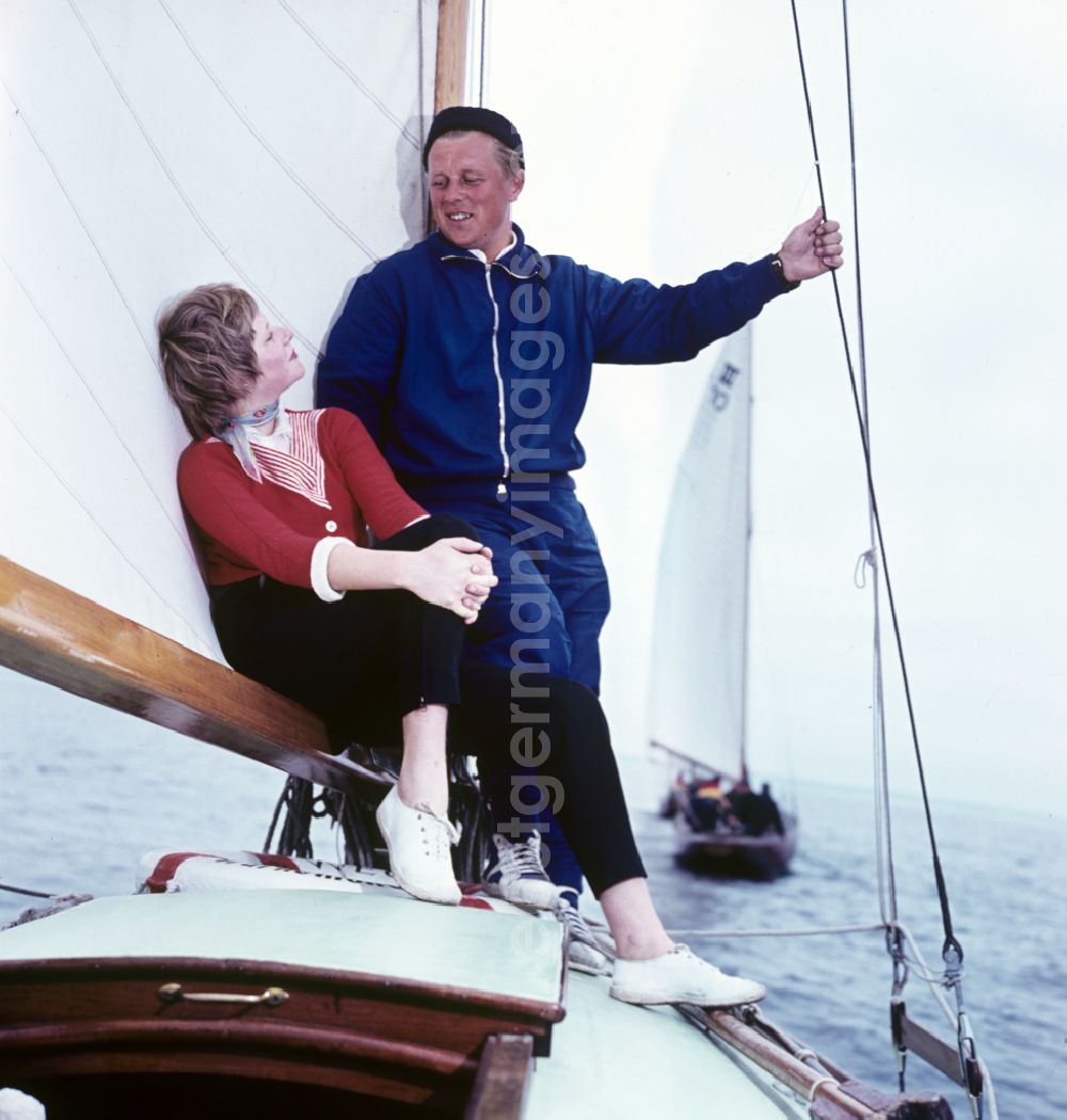 GDR image archive: Rostock - Young couple sailing on the Baltic Sea near Rostock, Mecklenburg-Western Pomerania in the territory of the former GDR, German Democratic Republic